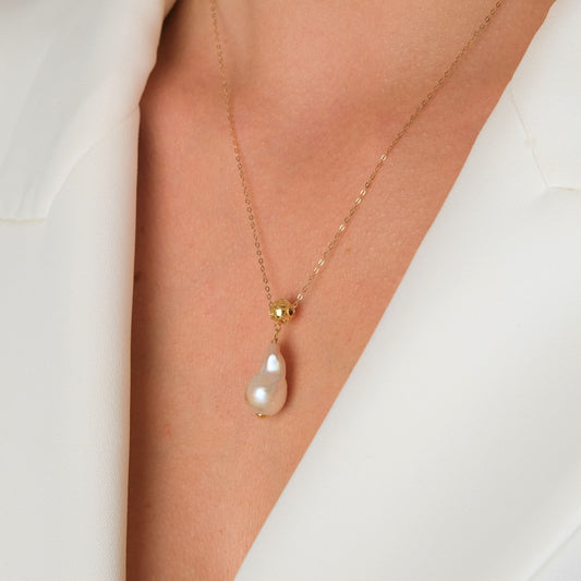 Necklace Viana's Conta in 19.2Kt Gold with Baroque Pearl styled on model - Gold jewelry