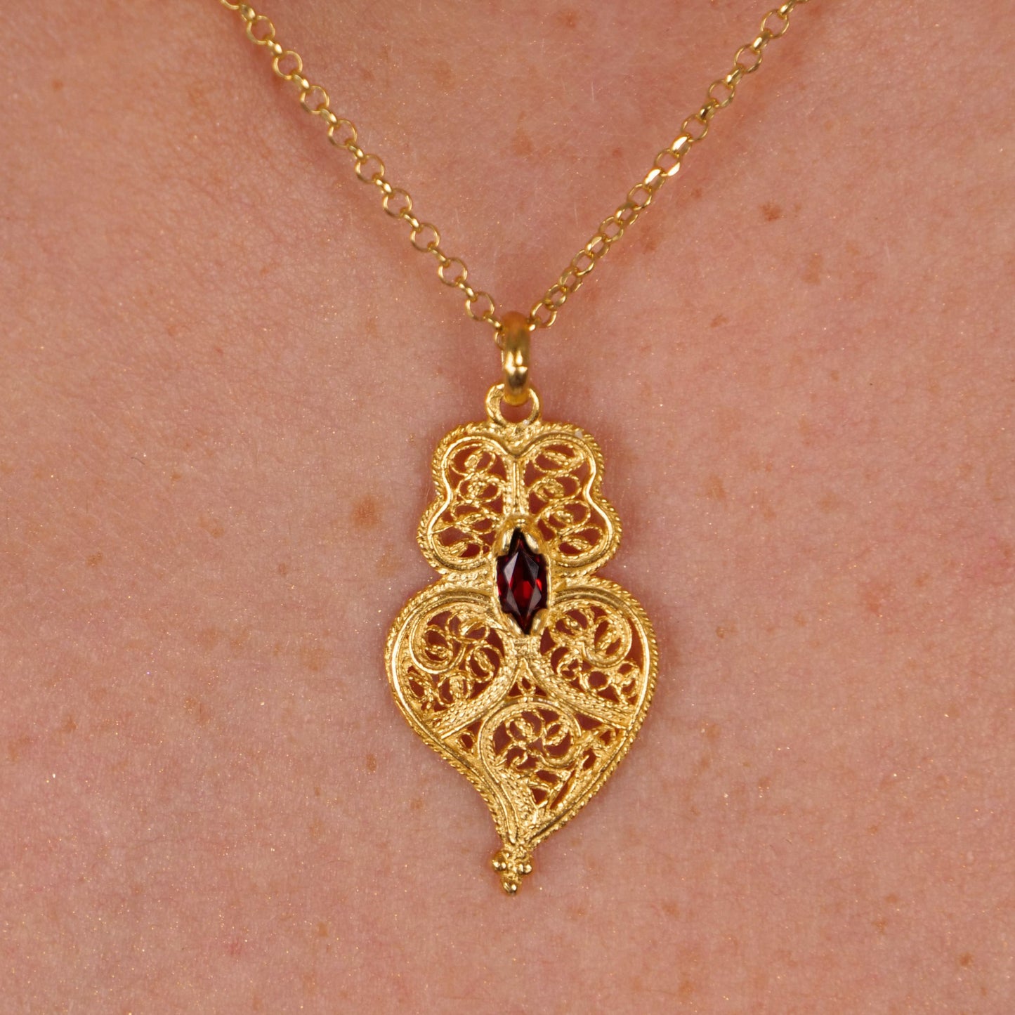 Necklace Heart of Viana Dark Red in Gold Plated Silver styled on model