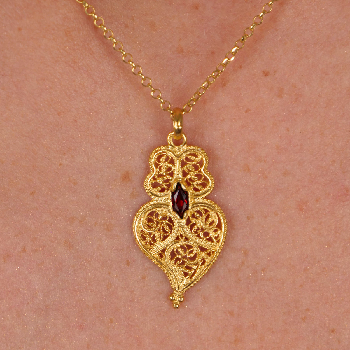 Necklace Heart of Viana Dark Red in Gold Plated Silver styled on model