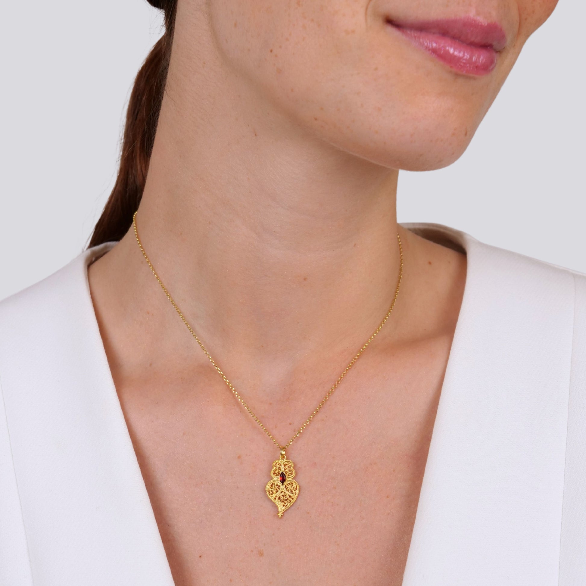 Necklace Heart of Viana Dark Red in Gold Plated Silver worn by model