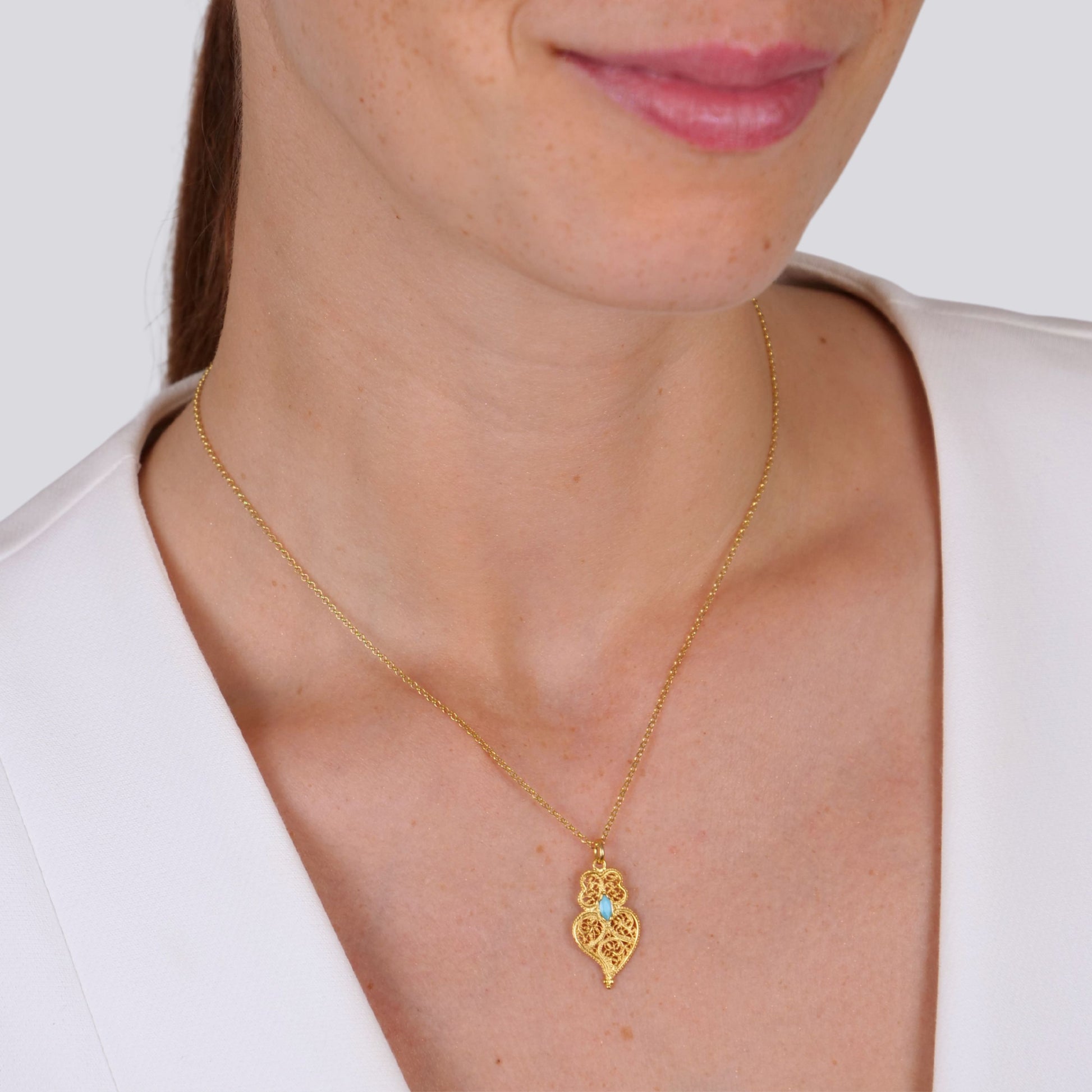 Necklace Heart of Viana Turquoise Blue in Gold Plated Silver styled on model